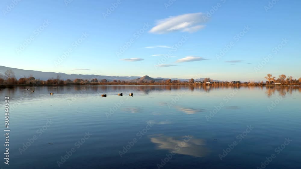 Reflection of clouds on the surface of the Coot Lake in Boulder, Colorado Reflection of clouds on the surface of the Coot Lake in Boulder, Colorado