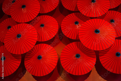 Obraz na plátně Red umbrellas capture an interesting display of Red patterns.
