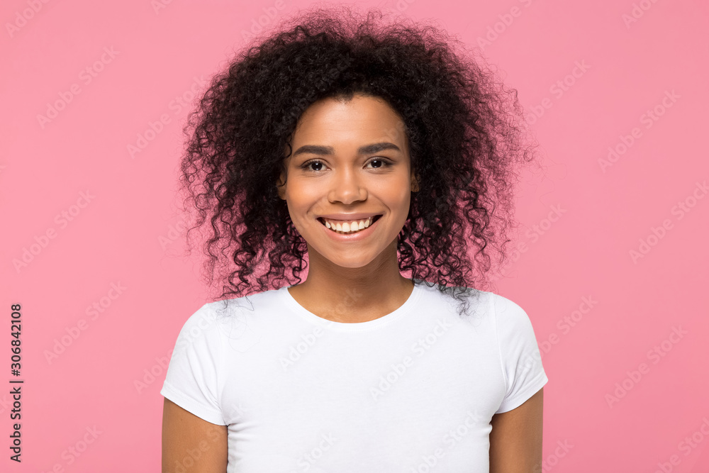 Head shot portrait smiling African American woman looking at camera