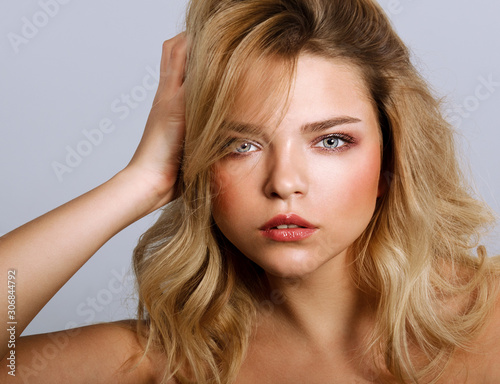 Beauty portrait of female face. Fashion model young woman with make up and hairstyle