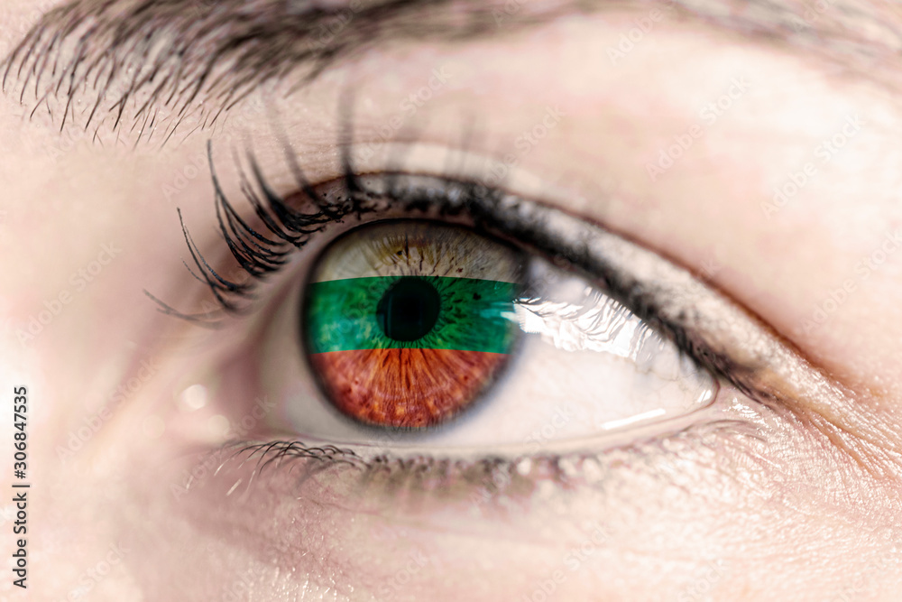 Fototapeta premium Flag of bulgaria reflects in woman green eye - close-up view - election, sport, hope, young, generation 