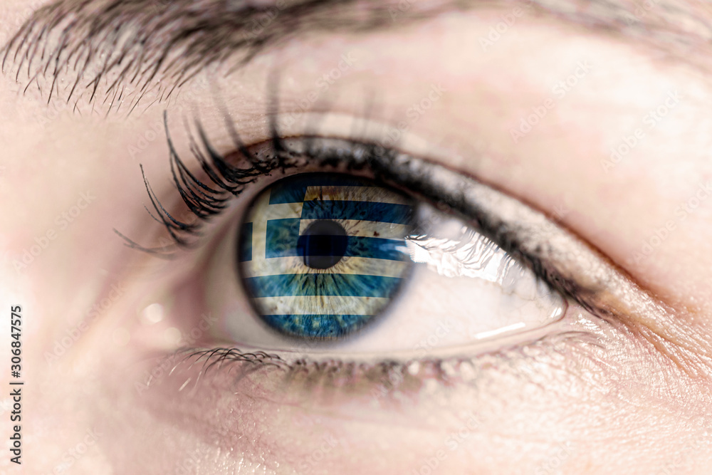Obraz premium Flag of greece reflects in woman green eye - close-up view - election, sport, hope, young, generation 