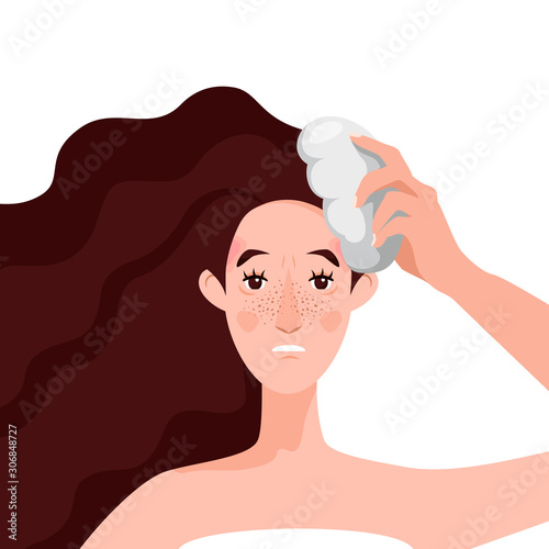A young woman suffers from a severe headache, pressing a pillow to her forehead. Migraine is constantly caused by depression, stress and nerves at work, as well as pain in the back and neck.