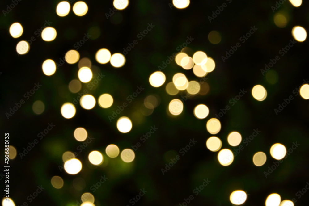 Many soft orange gold blurry bokeh light on green blur Christmas tree background in Christmas and New Year festival day, can use for background Many soft orange gold blurry bokeh light on green blur Christmas tree background in Christmas and New Year festival day, can use for background