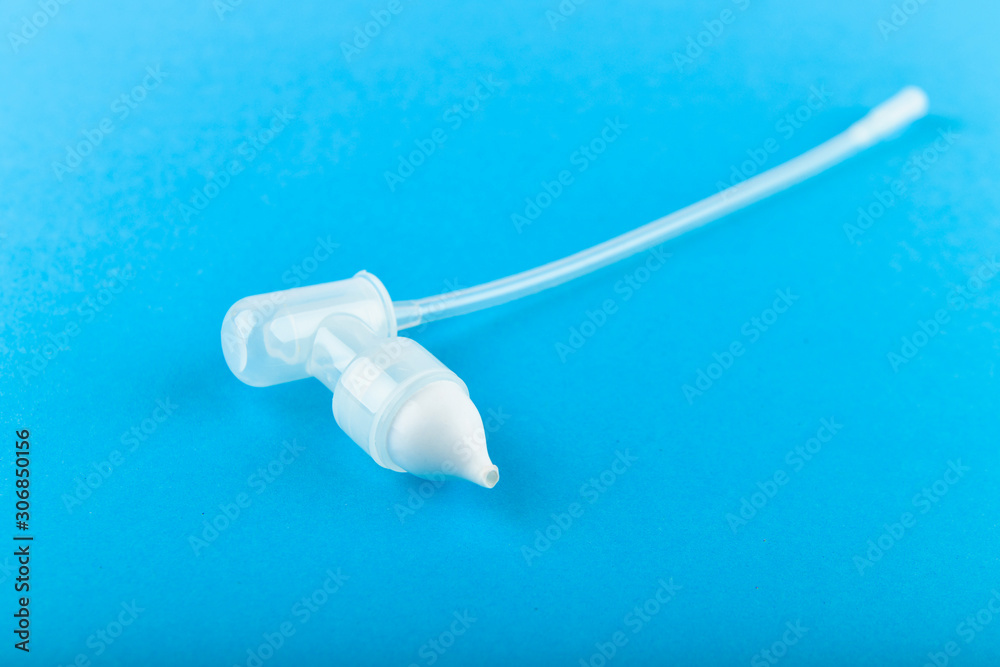 device for cleaning the nasal cavity, tube. On a blue background. children's nasal tube.