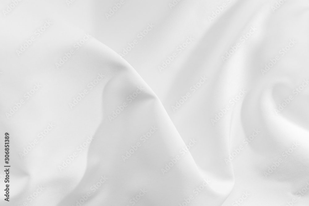 Abstract white fabric texture background. Cloth soft wave. Creases of satin, silk, and cotton. Abstract white fabric texture background. Cloth soft wave. Creases of satin, silk, and cotton.