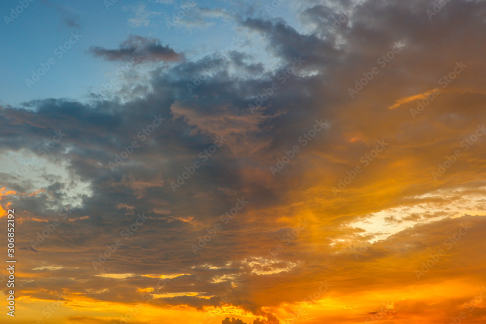 beautifull orange sunset with dark cloud on the sky, romantic moment 