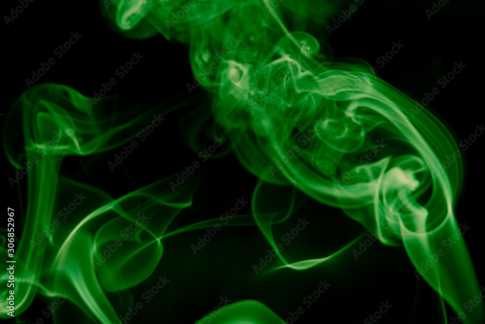 GREEN SMOKE AGAINST BLACK BACKGROUND GREEN SMOKE AGAINST BLACK BACKGROUND