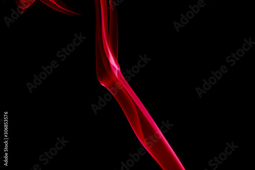 REDDISH SMOKE AGAINST BLACK BACKGROUND © muhammed