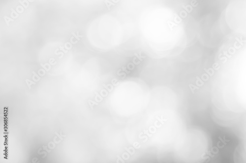 Abstract blurred white and silver color background with star glittering light for show,promote of advertise product have content in happy new year season collection concept & ad bokeh merry christmas.