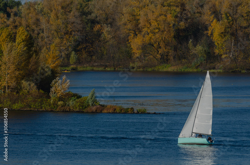 Yacht on the river in the golden autumn. Travels. Background