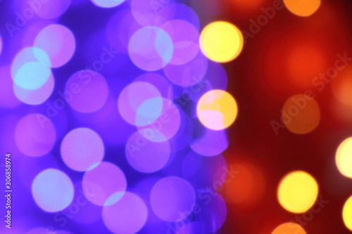 Many soft blue  purple  orange  red and yellow blurry bokeh light in Christmas and New Year festival day  can use for background
