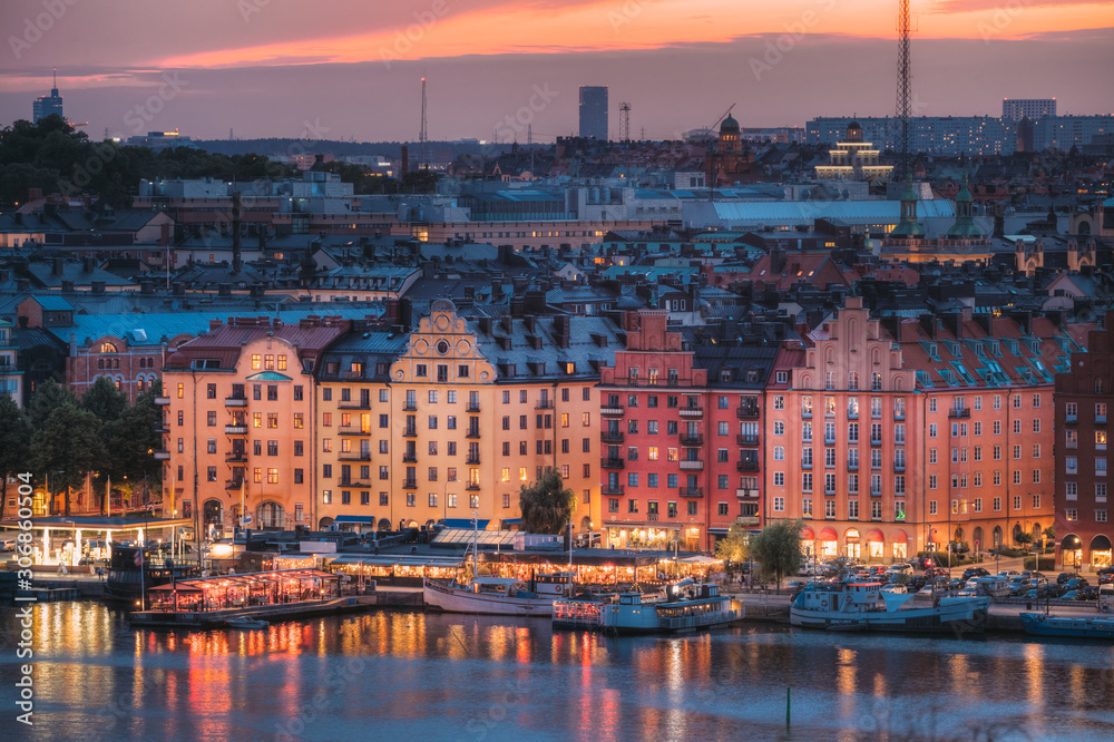 Stockholm, Sweden. Skyline View Of Residential Area Houses In Norr Malarstrand Street, Kungsholmen Island. Scenic View In Sunset Twilight Dusk Lights. Evening Lighting.