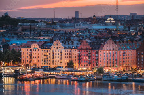 Stockholm, Sweden. Skyline View Of Residential Area Houses In Norr Malarstrand Street, Kungsholmen Island. Scenic View In Sunset Twilight Dusk Lights. Evening Lighting.