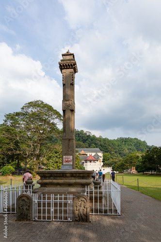Memorial pillar containing skull of Keppetipola Disawe at open park in front of Temple of the Tooth, a national Sinhalese hero lead rebellion against British, Candy, Sri Lanka.