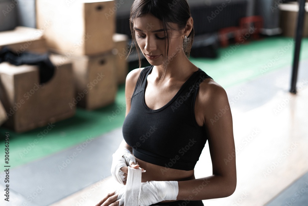 Sexy and fit woman preparing for training