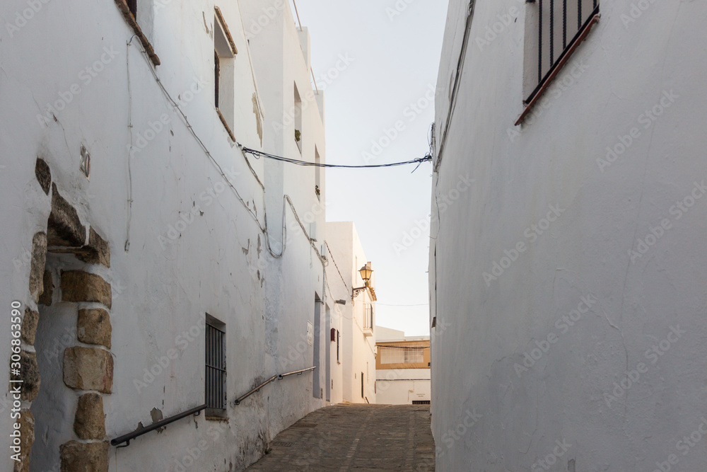 Facades of houses in the white village Vejer de la Frontera in Andalusia
