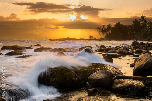 Fototapeta Naklejka Na Ścianę i Meble -  Romantic sunset on a tropical beach with palm trees