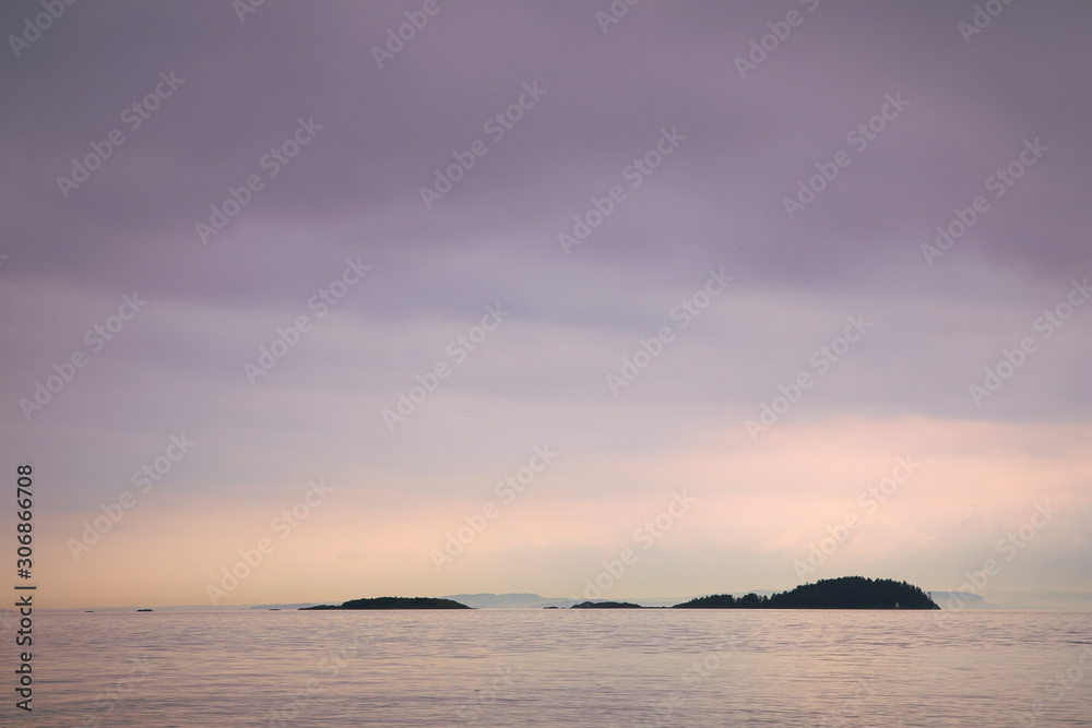 Scenic Oslo Fjord landscape, calm water, cloudy sky, small islands. , tranquil northern seascape. Norwegian coastline in summer. Nesodden, Norway. Nesoddtangen peninsula.