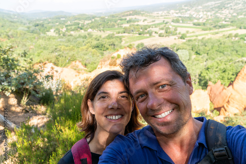Vacation couple selfie in rustrel village colorado Roussillon in provence france photo