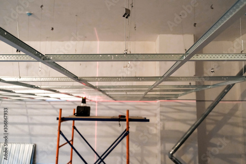 Schilderij op canvas the installation of suspended ceiling at the construction site