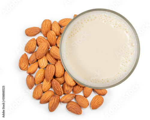 Glass of milk and almonds nuts isolated on white background. Top view.