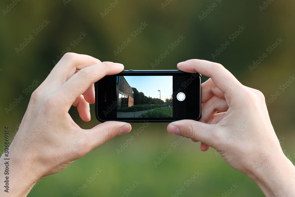male hand holds the phone. mobile photography. male hand holds the phone. mobile photography.