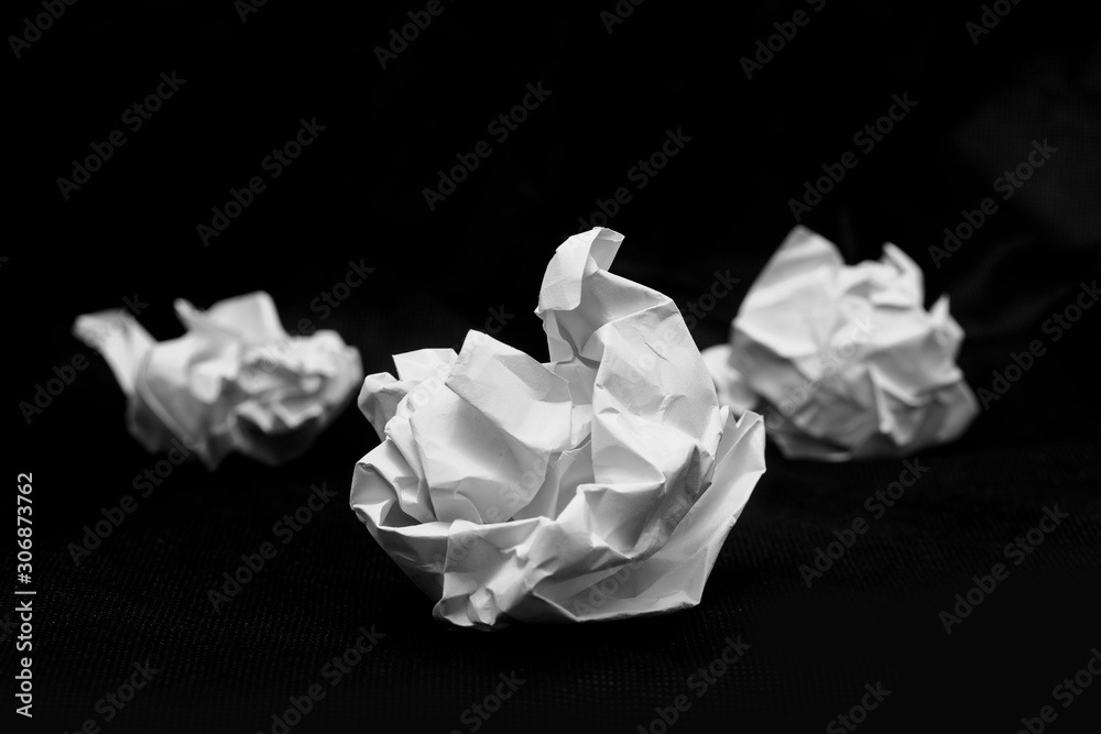 Roll the white paper into a ball and place it on a black background