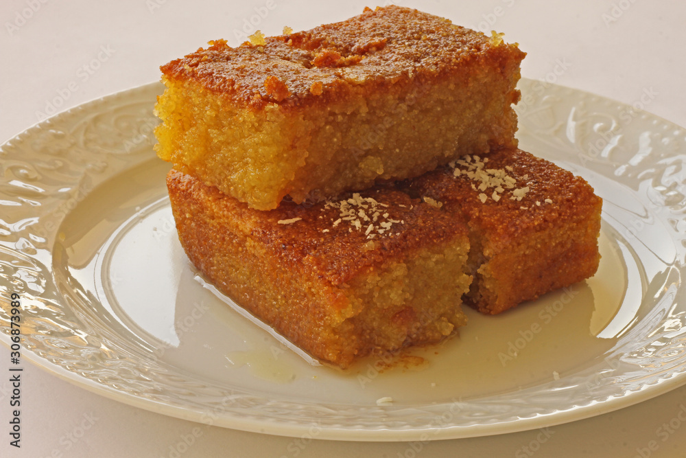 Shambali dessert made with semolina in a white plate. Shambali dessert made with semolina in a white plate.