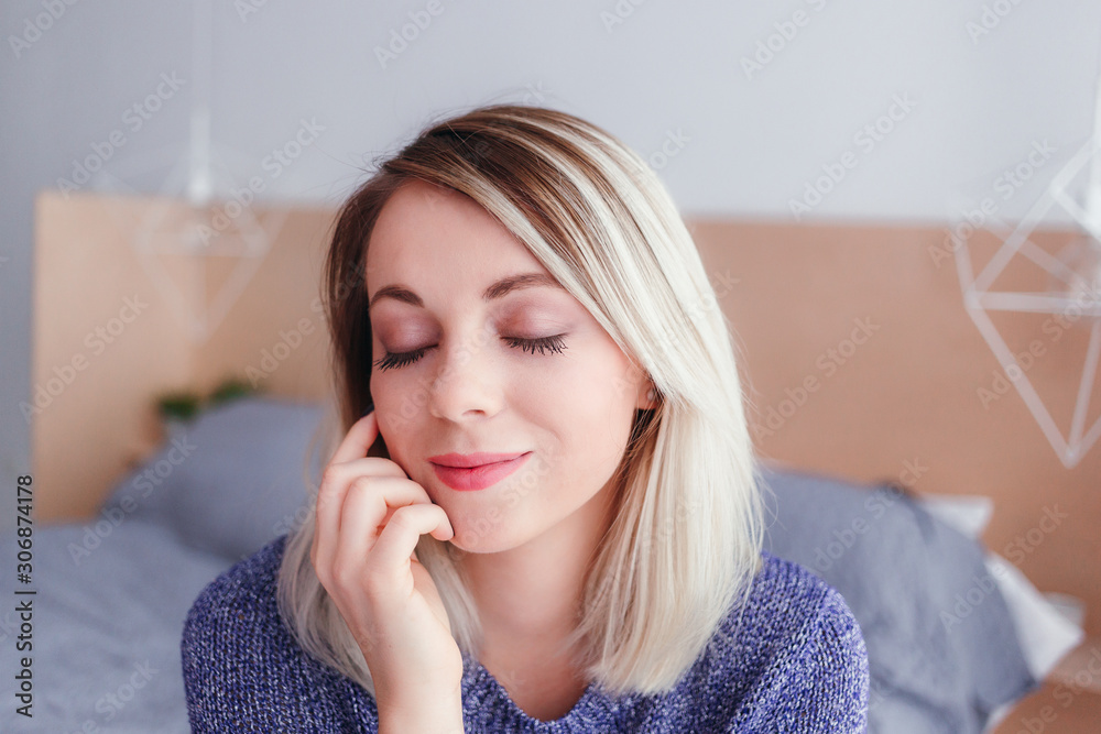Portrait of a young beautiful woman in a sweate Portrait of a young beautiful woman in a sweate