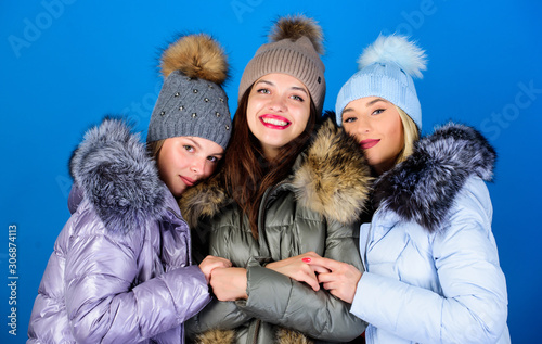 Female clothes shop. Modern trendy female outfit. Gorgeous girls makeup faces cuddling. Female fashion. Girls friends having fun in winter. Emotional women in jackets. Group friends hang out together