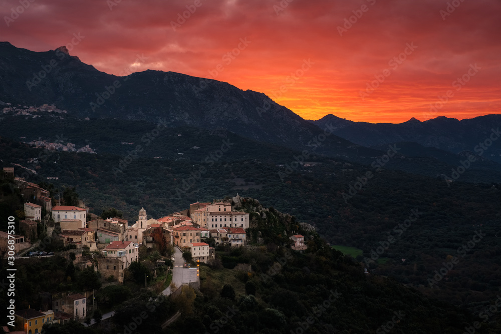 Orange sunset over village of Belgodere in Corsica
