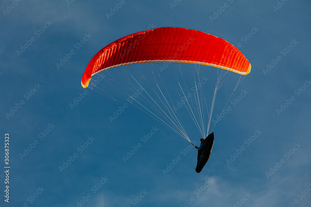 View of a paragliding in the sky. Paraglider flying over in The nature park Zumberak, Croatia View of a paragliding in the sky. Paraglider flying over in The nature park Zumberak, Croatia