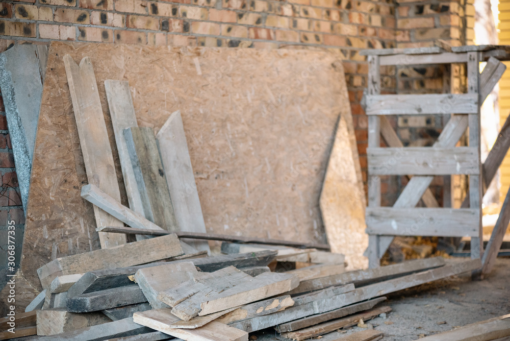 Lumber a construction material on construction site background. Lumber a construction material on construction site background.