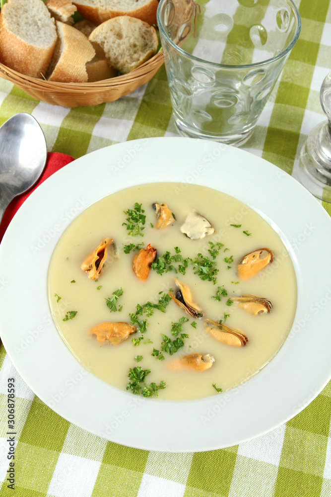 plate of mussel soup on a table plate of mussel soup on a table