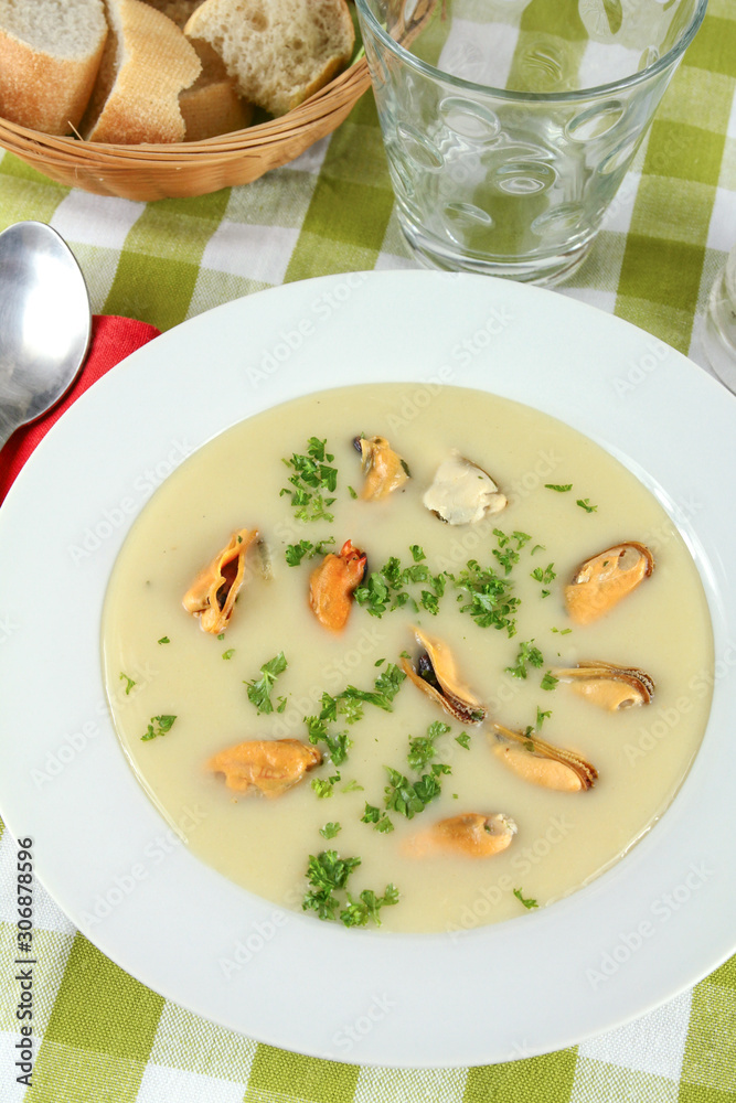 plate of mussel soup on a table plate of mussel soup on a table