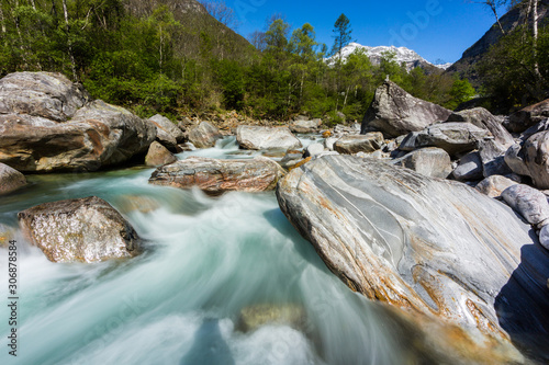Tableau sur toile colorful Verzasca river in Ticino in Switzerland in spring, blue sky