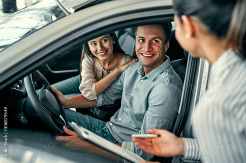 At a car dealership, buying a car