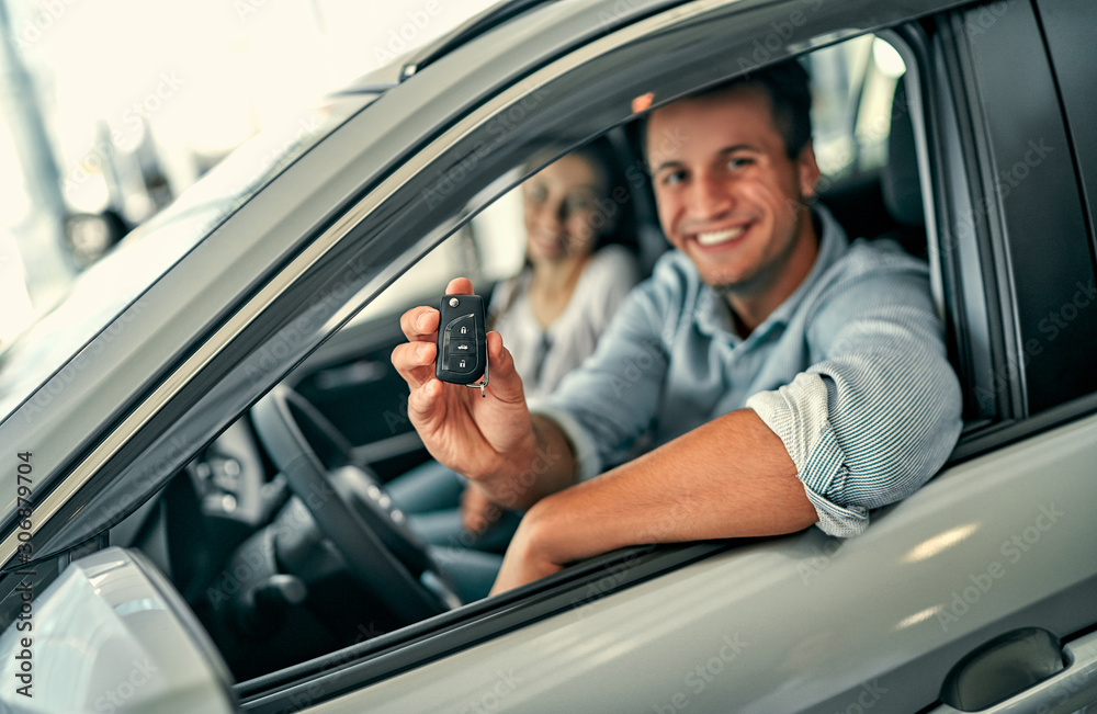 At a car dealership, buying a car At a car dealership, buying a car