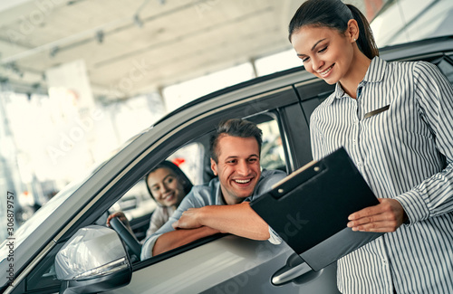 At a car dealership, buying a car