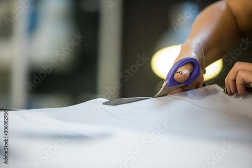 hand holding seizures cutting fabric