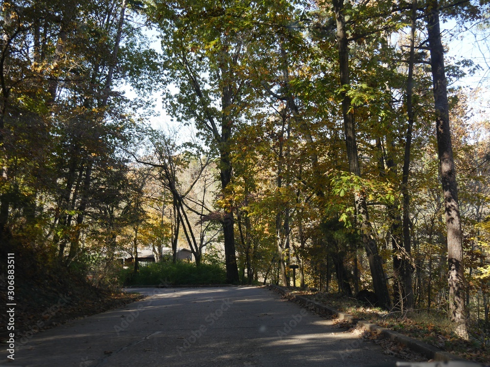 Scenic drive along winding road and colorful trees in autumn, Arkansas. Scenic drive along winding road and colorful trees in autumn, Arkansas.