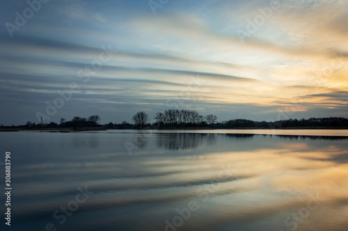 Beautiful evening clouds reflecting in the lake water