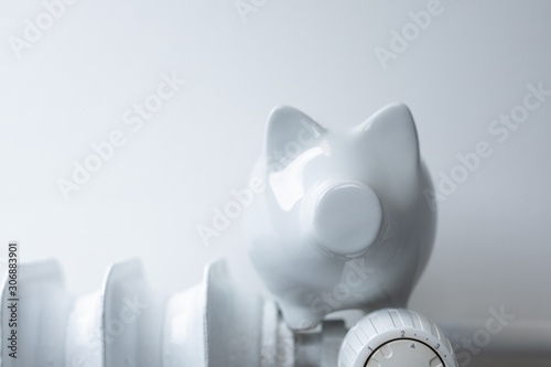 heater money pig on white wall