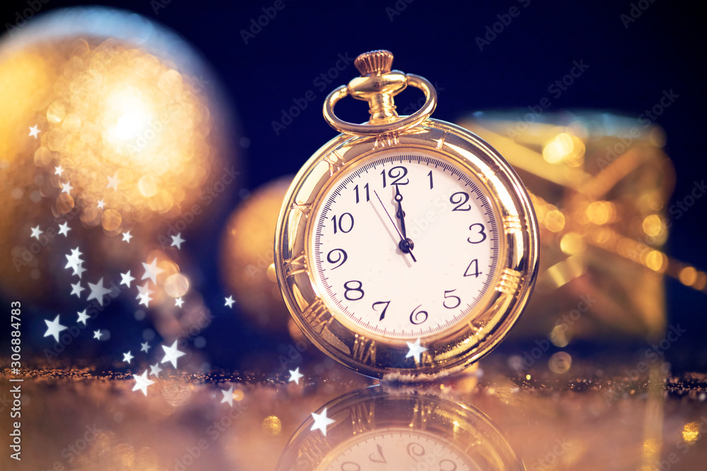 New Year's at midnight - Old clock with holiday lights New Year's at midnight - Old clock with holiday lights