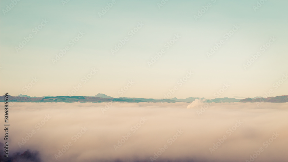 Thick fog just below mountains