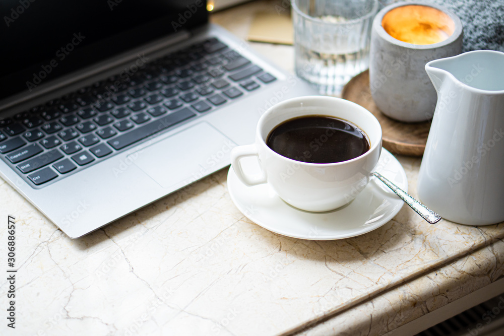 Cozy freelancer's winter work place at home with cup of coffee Cozy freelancer's winter work place at home with cup of coffee