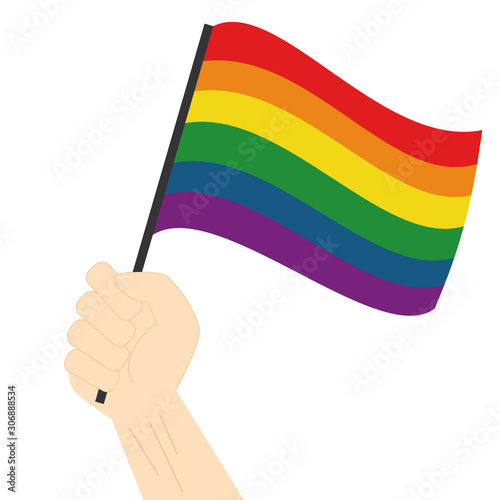 Hand holding and raising Rainbow pride flag isolated on white background