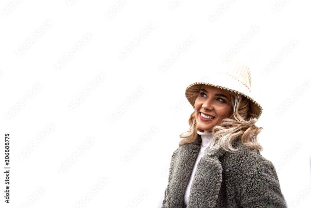 Fashion woman posing at the background street brick wall, dressed modern clothes. Female moder wearing faux fur coat, tutleneck, skirt and bag Fashion woman posing at the background street brick wall, dressed modern clothes. Female moder wearing faux fur coat, tutleneck, skirt and bag