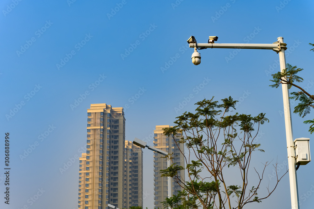 CCTV cameras and residential building on back CCTV cameras and residential building on back